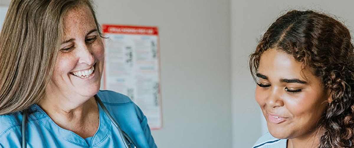 A Hurley clinician reviewing weight loss options with a patient
